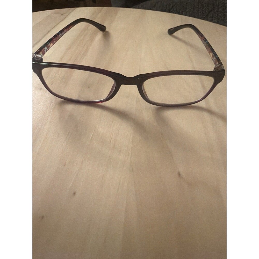 Pretty burgundy eyeglass frames with colorful floral detailing along the temples